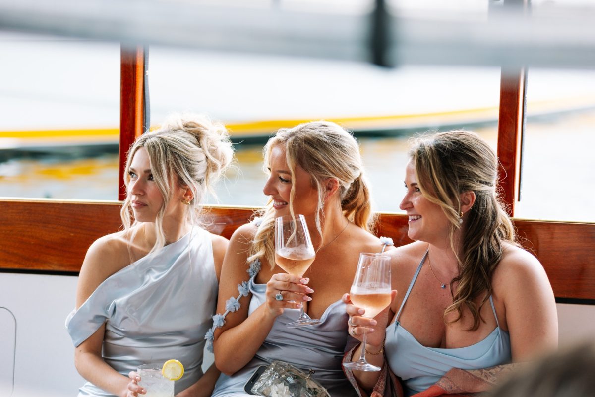 a group of women sitting on a boat