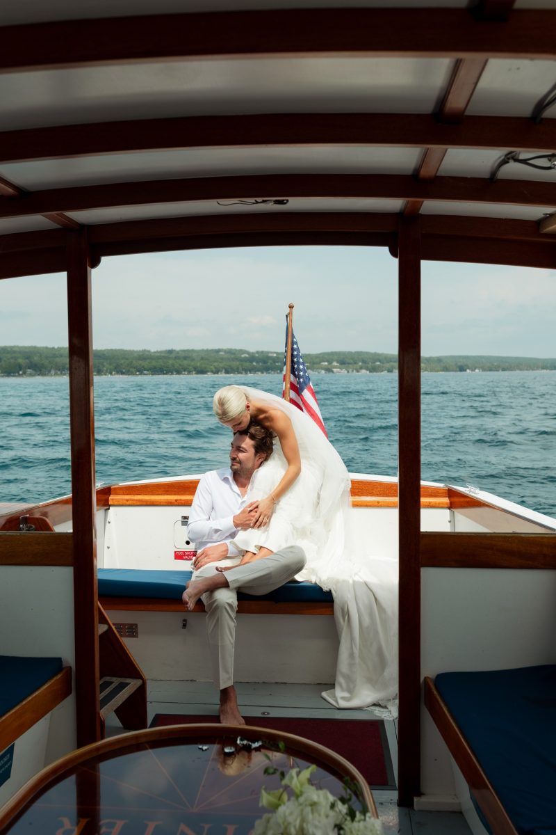 a man and woman in wedding dress on a boat